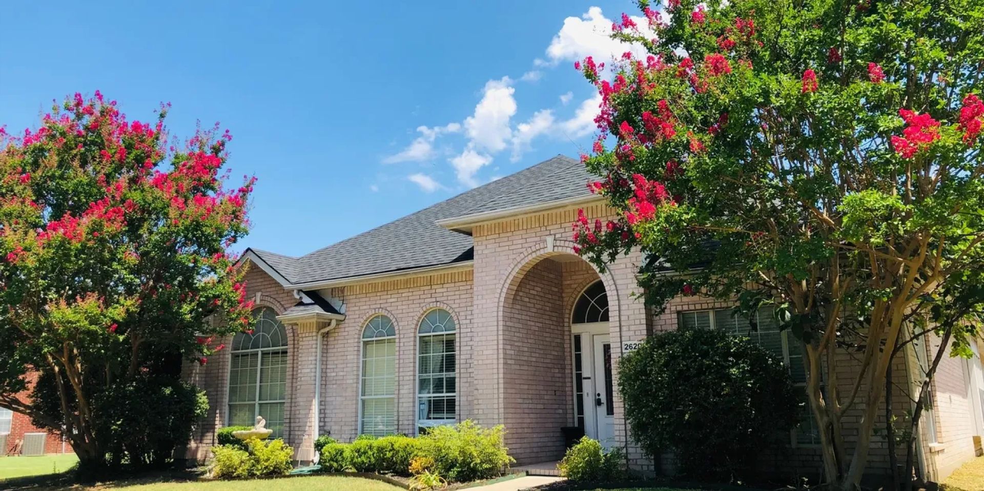 Front of Brythaven at St. Michelle with lawn and crepe myrtle trees
